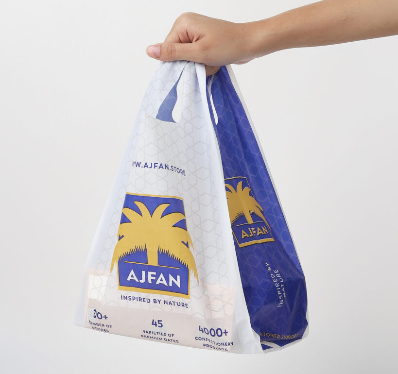 Compostable printed carry bags — T-shirt and flat-handle styles, custom printable for retail stores, grocery chains, restaurants, and takeaway packaging.